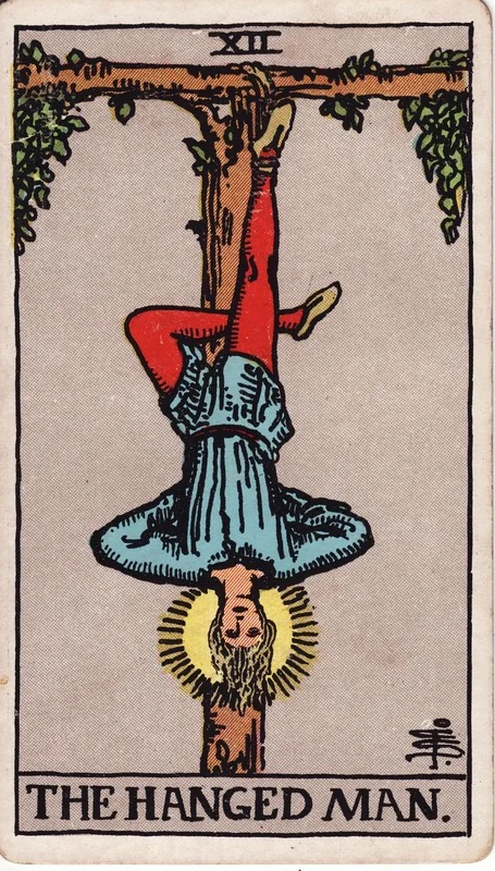 The Hanged Man tarot card from the Rider-Waite deck (1909, public domain)