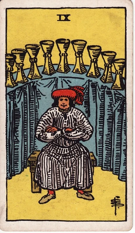 Nine of Cups tarot card from the Rider-Waite deck (1909, public domain)