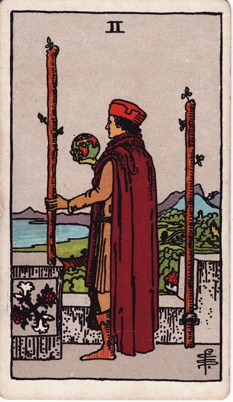 Two of Wands tarot card from the Rider-Waite deck (1909, public domain)